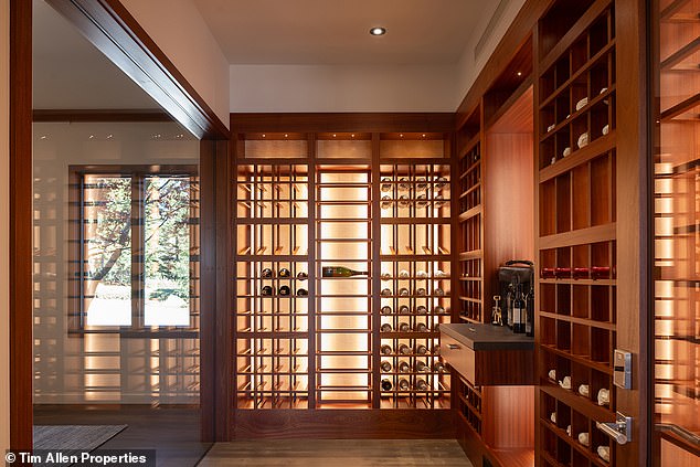 The custom-built wine room can accommodate up to 1,000 bottles and has built-in storage space right on the wall.  There's even a door with a touchpad lock along one of the walls and a minibar for storage and drink preparation