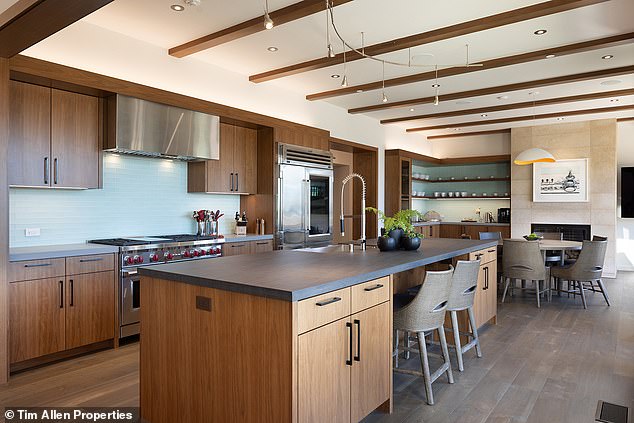 The kitchen is equipped with a large hob and stove, along with a long island and space for a table.  MacNeil renovated the entire house which was originally built in 2000.  He said the price of the renovations was more than $10 million