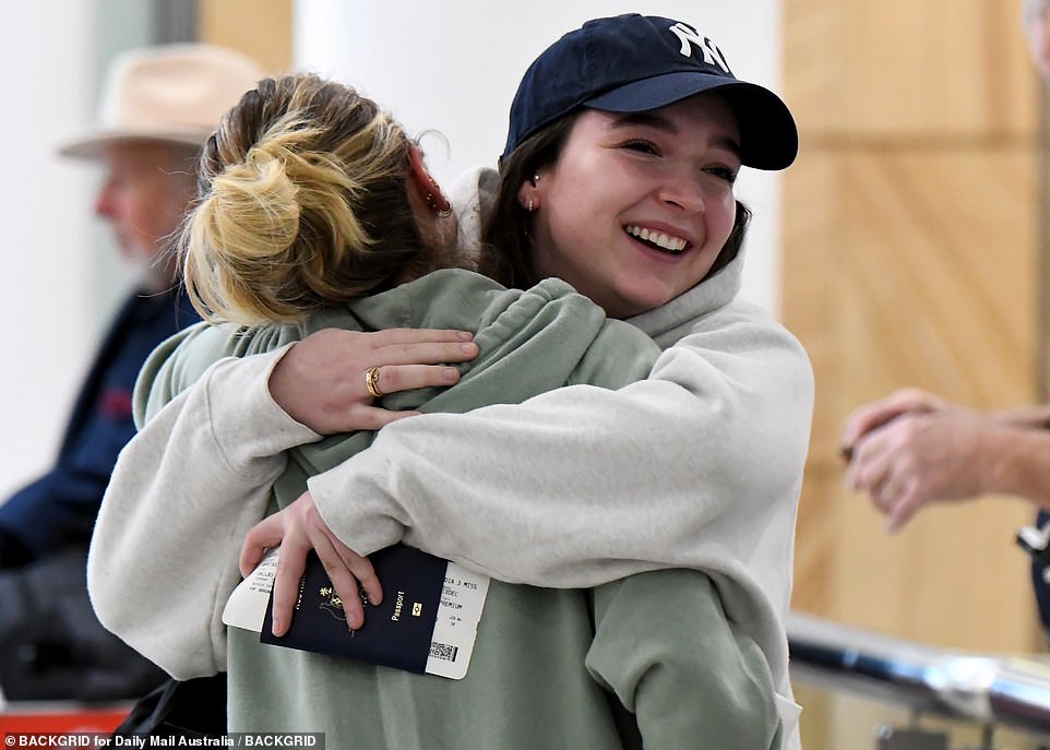 Passengers on flights landing at Sydney Airport on Wednesday morning hug each other