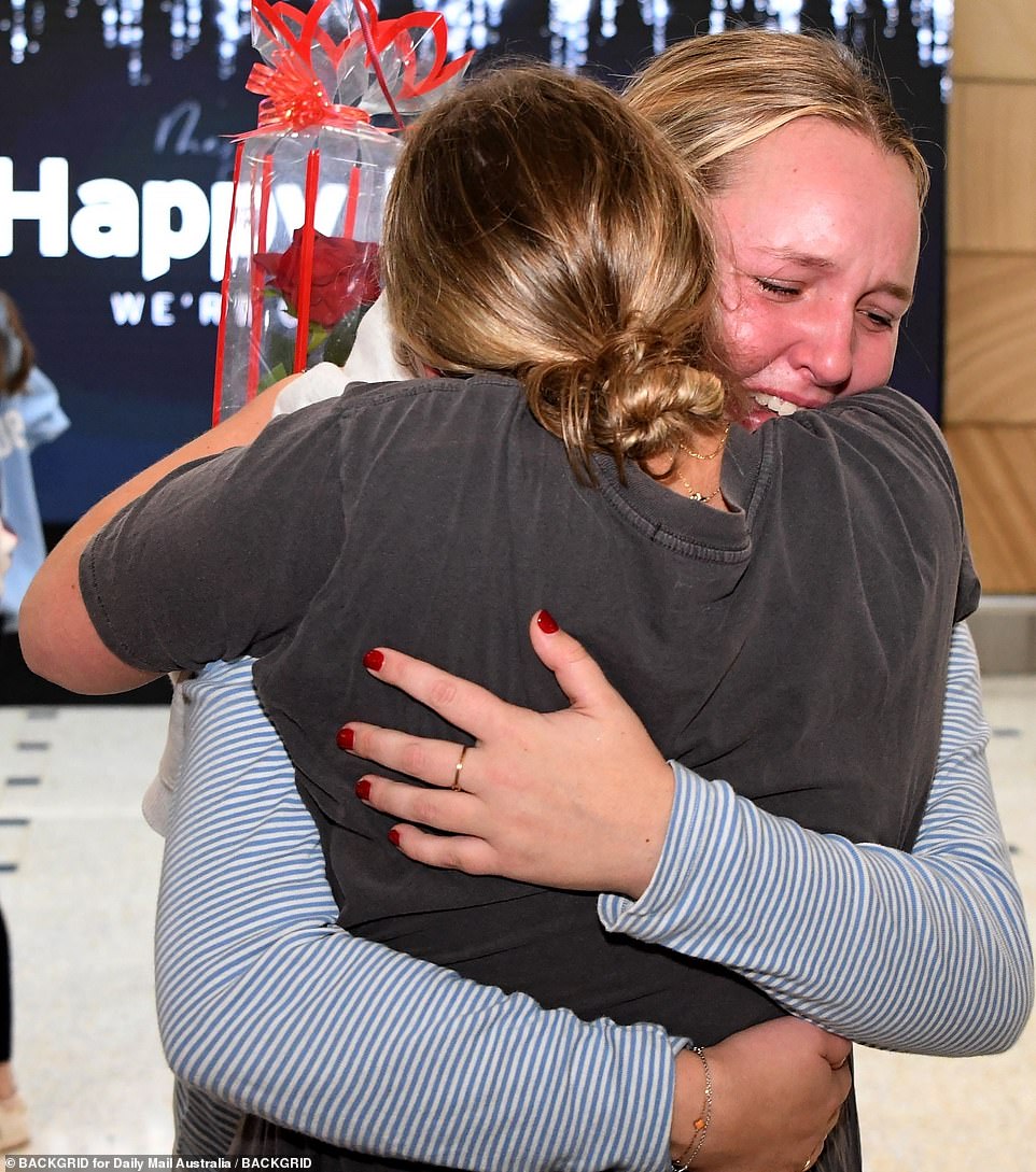 A young traveler was welcomed with open arms upon arrival at Sydney's international terminal