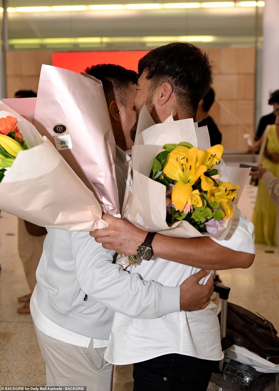 Many gave their loved ones flowers when they arrived in Sydney for the Christmas holidays