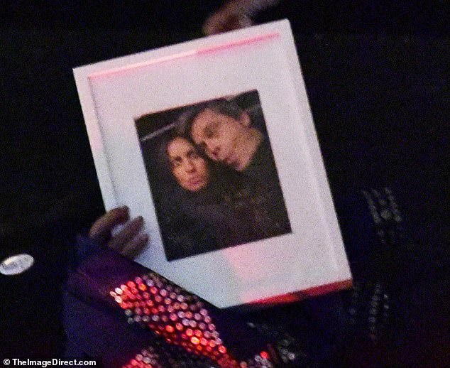 A selfie of the couple was also revealed as a party guest held a framed photo of Brad and Ines making duck faces in a rare candid moment.