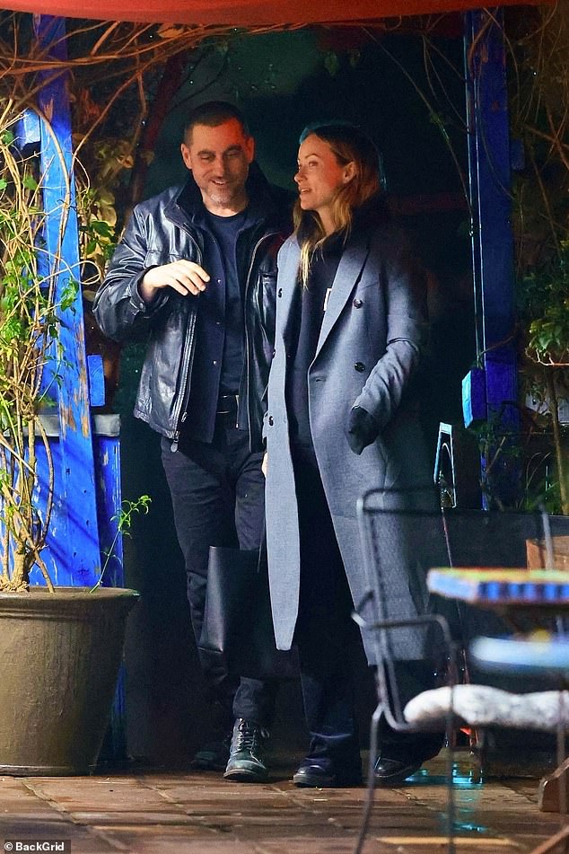 Olivia paired her hoodie with black wide-leg pants and chunky black boots