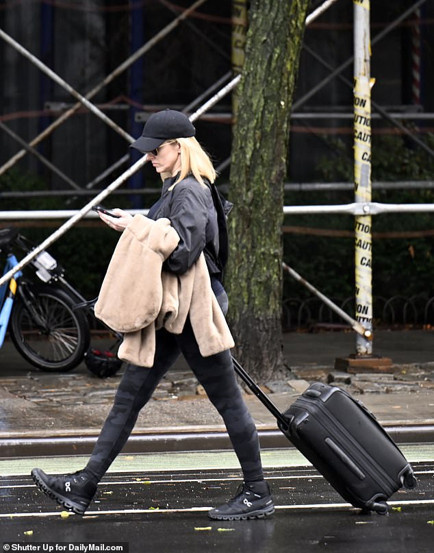 Stark opted for another casual look, including black camouflage leggings and the same baseball cap she wore earlier this weekend when she left De Blasio's on Monday with luggage in tow.