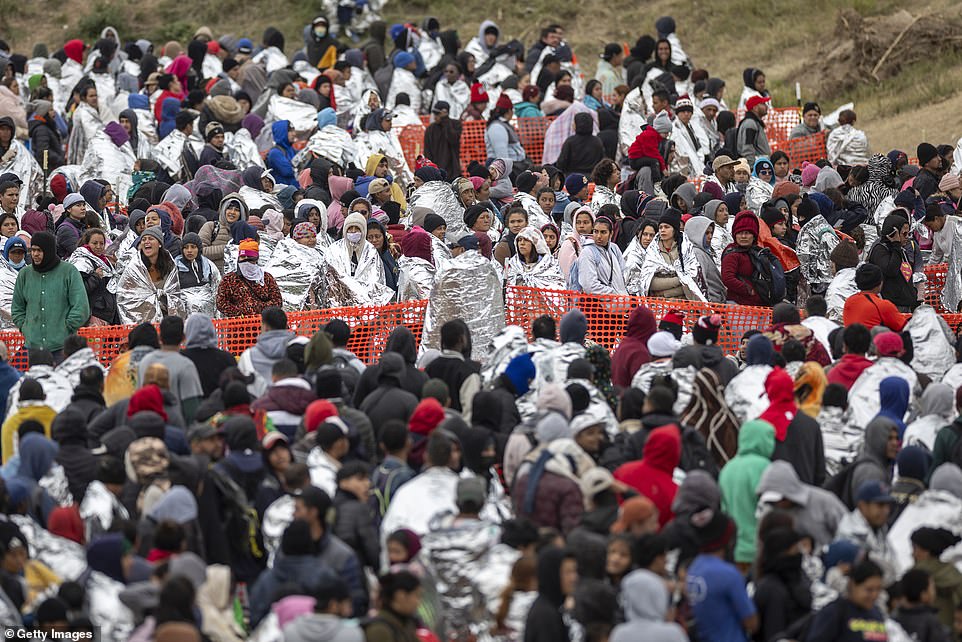 About 1,000 migrants waited to be processed at a U.S. Border Patrol processing center Wednesday after crossing the border from Mexico in Eagle Pass, Texas, on Dec. 20, 2023