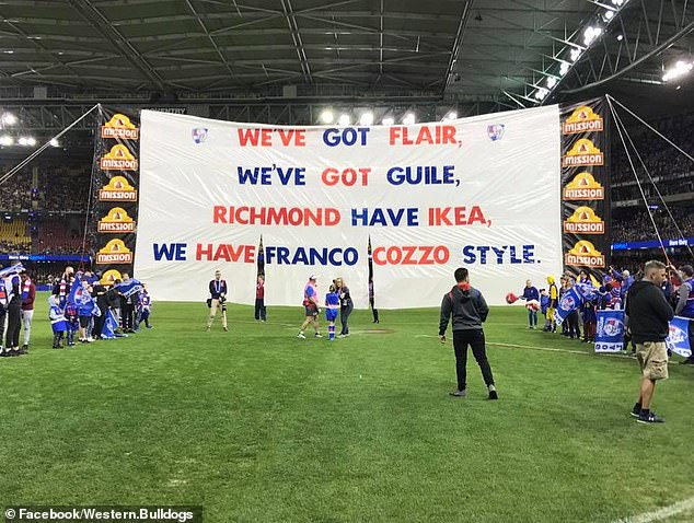 The Western Bulldogs pay tribute to Franco Cozzo during an AFL match