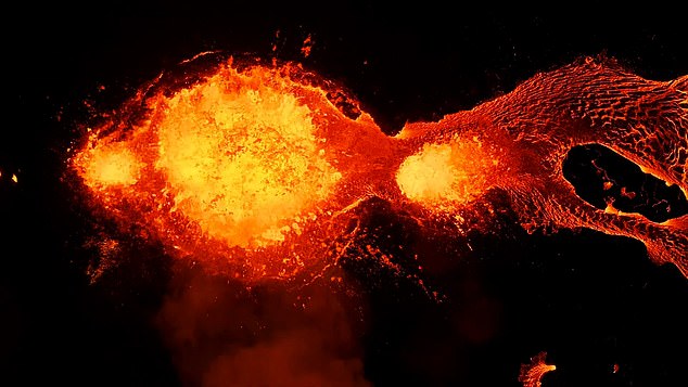 The breathtaking images show bright orange lava breaking through the Earth's surface in fountains of fiery molten rock