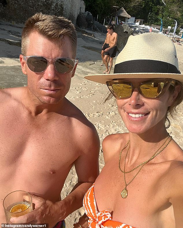 Warner's wife Candice (pictured together) also fired at Johnson after her husband powered his way to a first-innings score of 164 in Perth