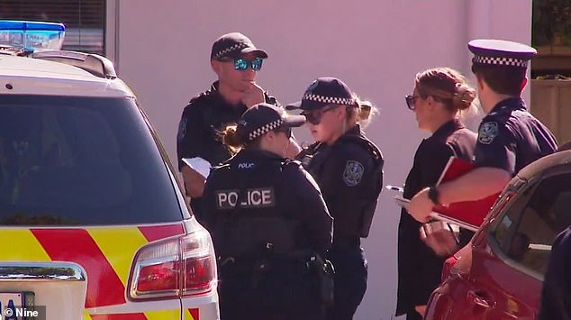 Police officers are pictured at the scene of the alleged attack on Wednesday