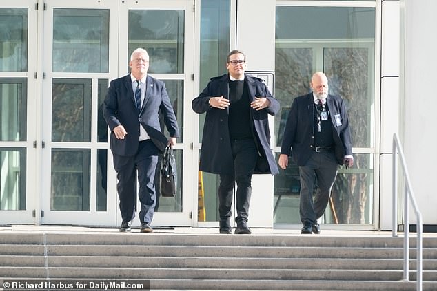 Santos' attorney Joseph Murray (left) managed to get the judge to move the case and allow the parties to focus on a plea deal for Santos (center)