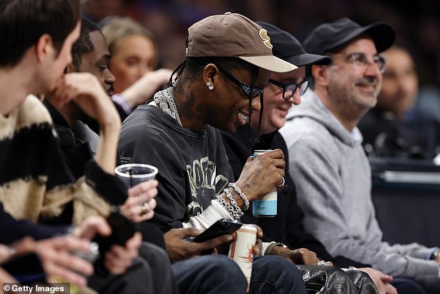 1703140312 311 Despair for Travis Scott as rappers drink EXPLODES at courtside