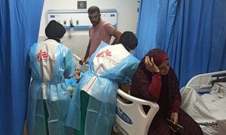 Doctors Without Borders staff treat a young patient at al-Shifa hospital