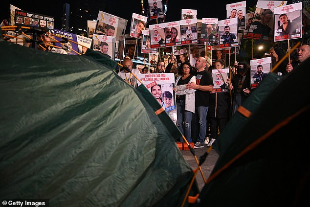 Families of the hostages set up tents to sleep in after marching to the Kirya on December 16, 2023