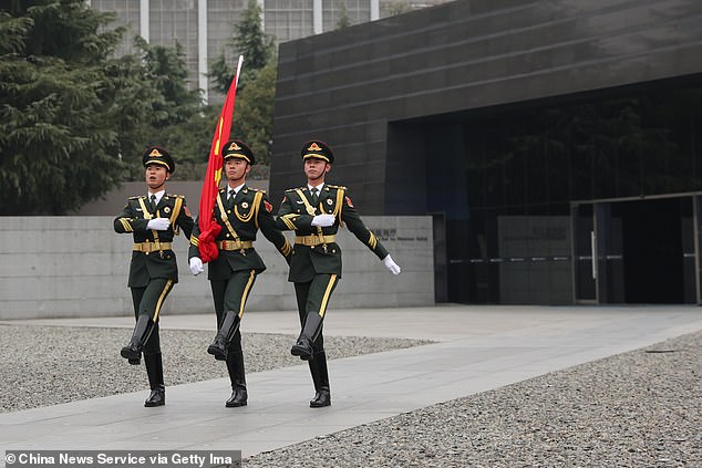 A 2022 Chinese military report identified “five battles of cognition” to shape future conflicts.  Pictured: The Chinese People's Liberation Army (PLA) honor guard performs a flag-raising ceremony