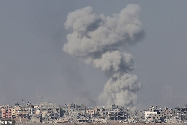 Smoke rises after an Israeli airstrike on Gaza on December 20, as the Jewish State continues to bomb the region in the wake of Hamas' attack on October 7