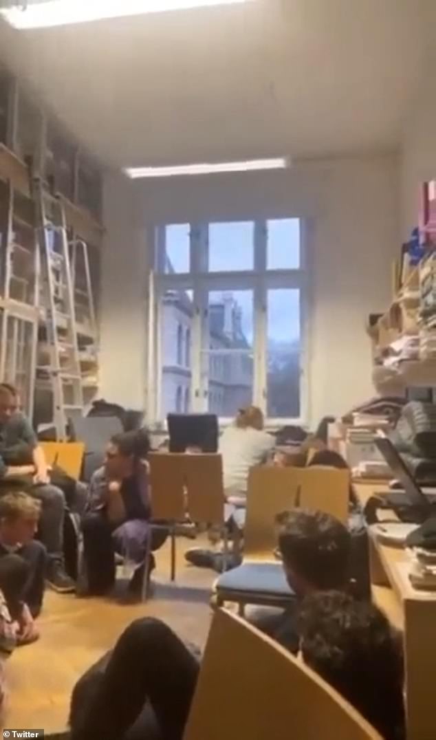 Footage from this classroom shows students sitting in silence before a single shot is heard