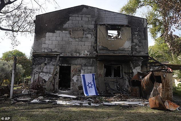Destroyed houses are seen in Kibbutz Be'eri, Israel, Wednesday, December 20, 2023. The kibbutz was overrun by Hamas on October 7