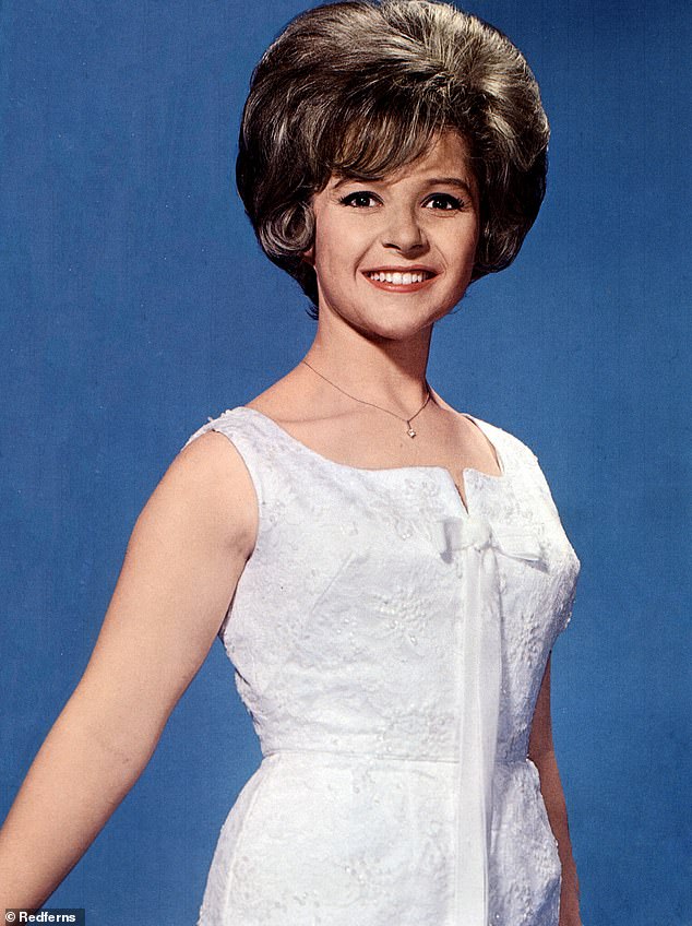 Lee recorded the song when she was just 13, but it recently reached number one for the first time after toppling Mariah Carey's All I Want For Christmas Is You;  pictured in 1959