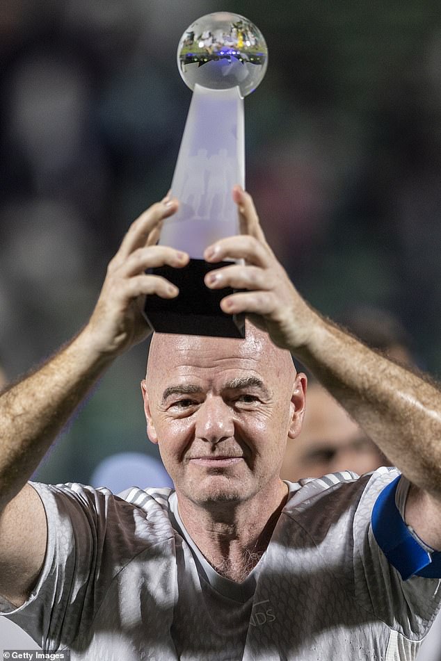 FIFA president Gianni Infantino was seen lifting a trophy, but the score remains unclear