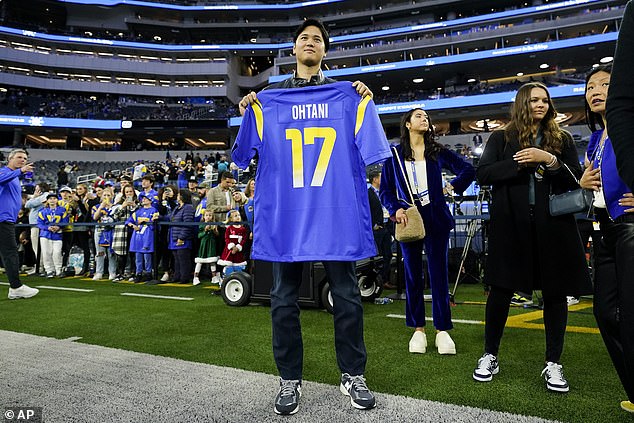 Ohtani posed wearing a Rams jersey with No. 17 on the back as he turned heads before kickoff