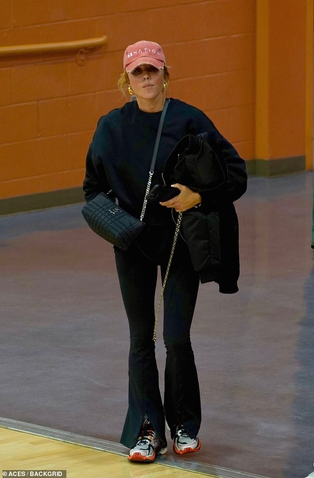 The PE Nation founder looked effortlessly cool for the occasion in an athleisure outfit consisting of a loose-fitting black sweater paired with black pants and white sneakers