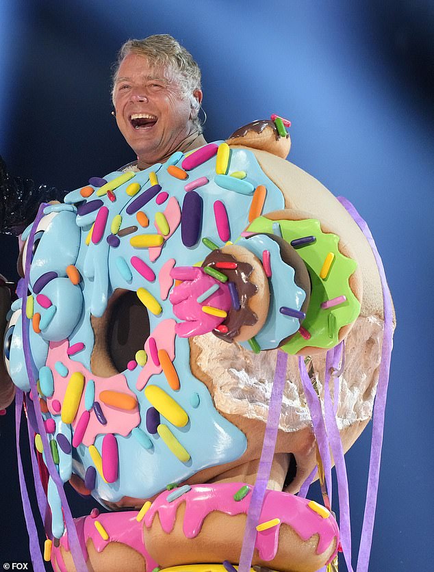 Schneider was exposed as the celebrity behind the donut costume on The Masked Singer on the same day he wrote the threatening post