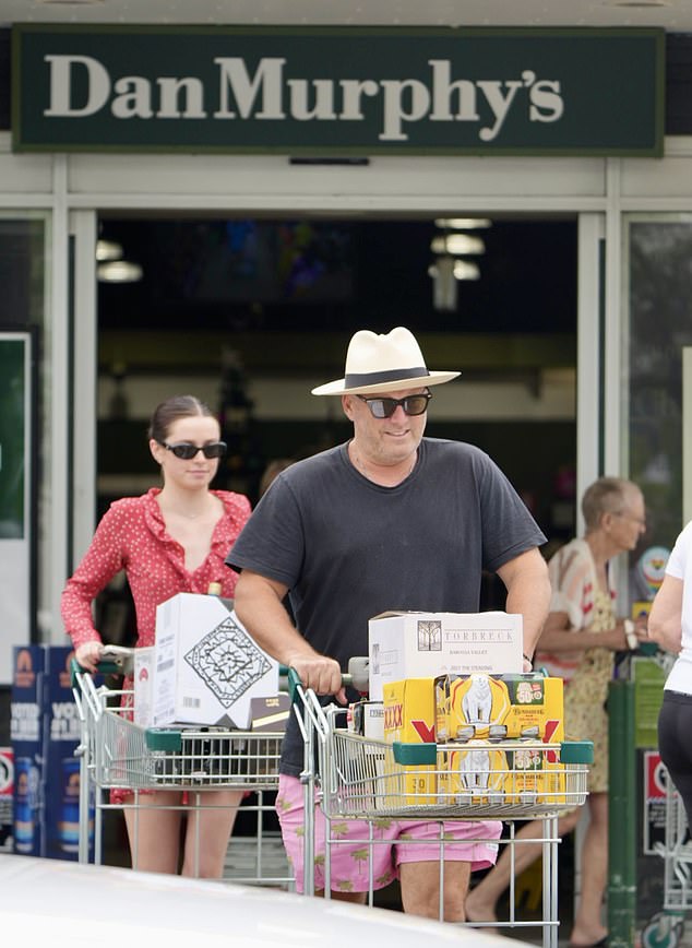 Karl just smiled as he left the liquor store with a cart full of drinks