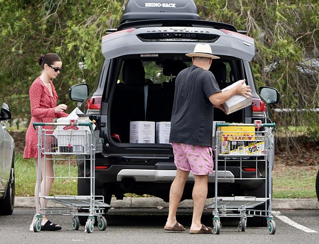 Father and daughter loaded the trunk together before heading off to spend some time with the family