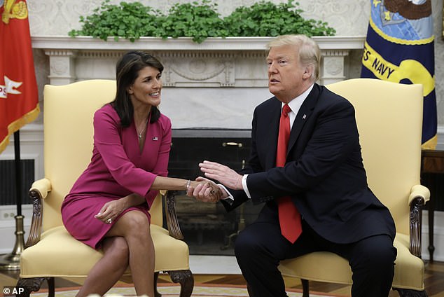 Nikki Haley is seen in the Oval Office with Donald Trump in October 2018, when she resigned as his UN ambassador.  She was praised for managing to keep Trump and his supporters on side but unaffected by the proximity