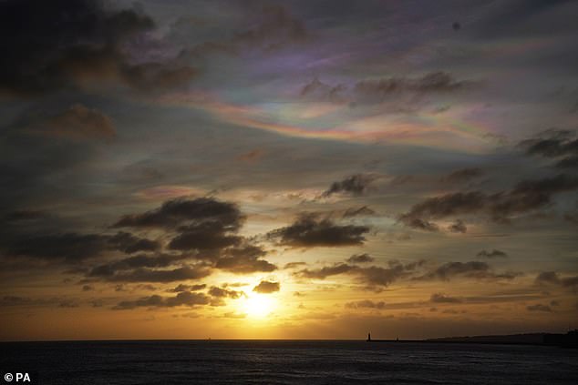 Photographers in Teesside, Yorkshire and even Kent have captured snapshots of the strange formations, which consist of tiny ice particles that scatter light.  Pictured: Clouds off the coast of Tynemouth