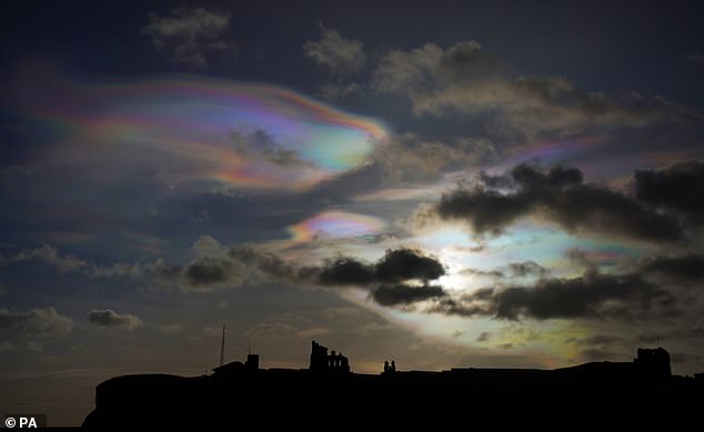 Pearly clouds are rare clouds that form in the lower stratosphere when the sun is directly below the horizon.  They look like large, thin disks, and are often confused with UFOs thanks to their unusual bright colors