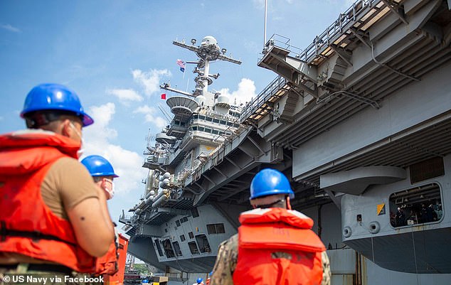 Navy personnel were photographed working on the USS George HW Bush in July 2020