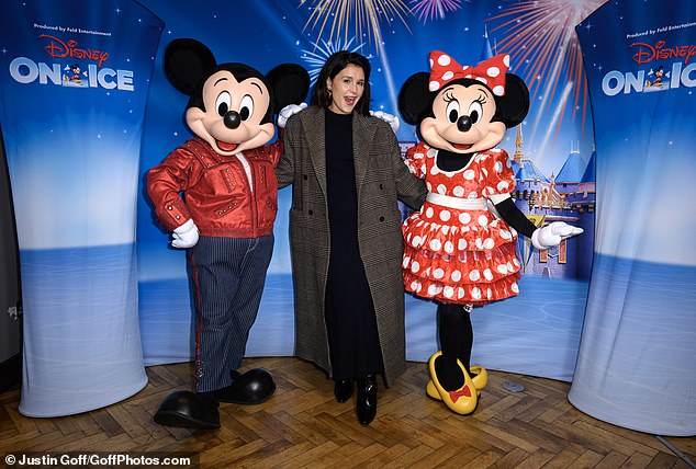 Jessie Ware, 39, looked very excited as she had her photo taken with Mickey and Minnie as she posed for photographers at the star-studded event