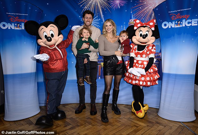 Ashley James looked stunning in black leather shorts, tights and brown sweater as she posed with her partner Tommy Andrews and their children;  Alfie, Ada aged two and nine months