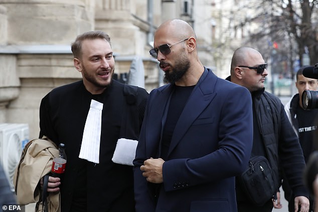 Former professional kickboxer and social media influencer Andrew Tate (R) and his lawyer Eugen Vidineac (L) leave the courthouse in Bucharest, Romania, December 22, 2023