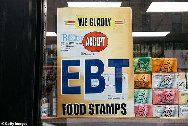 A Brooklyn grocery store displays a sign warning customers about the benefits of SNAP food stamps