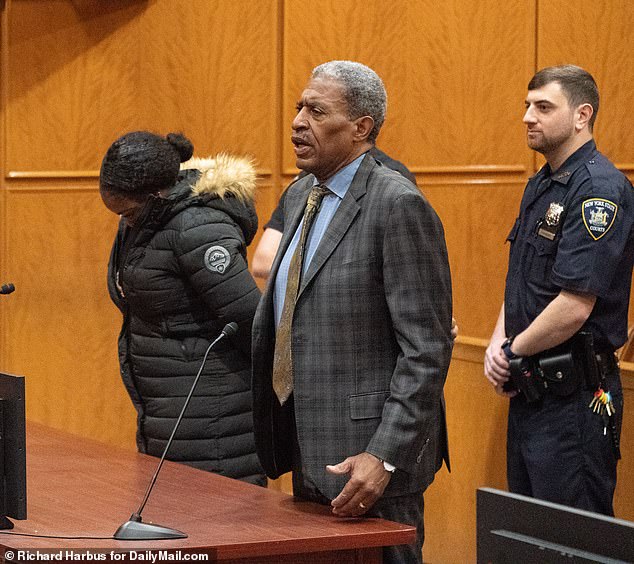 Shanica Callaghan (left) was dragged in handcuffs before the Queens Supreme Court in New York City on Thursday, charged with manslaughter