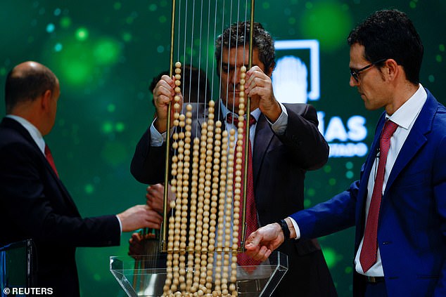 Lottery workers prepare the lottery numbers with the winning prizes before the start of the draw of the traditional Spanish Christmas lottery 'El Gordo' at Teatro Real, in Madrid, December 22