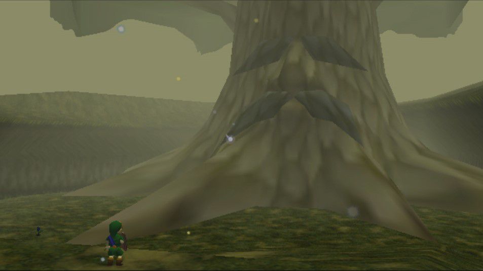 A child Link stands in front of the Great Deku Tree, a giant tree with a sad face, in Zelda: Ocarina of Time