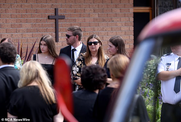 Hundreds of mourners, including family, friends and colleagues, gathered at the church to pay their respects