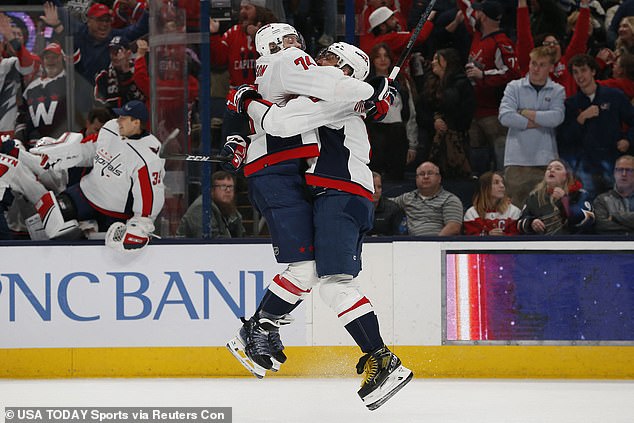 Ovechkin jumped into the arms of teammate John Carlson after scoring the game winner