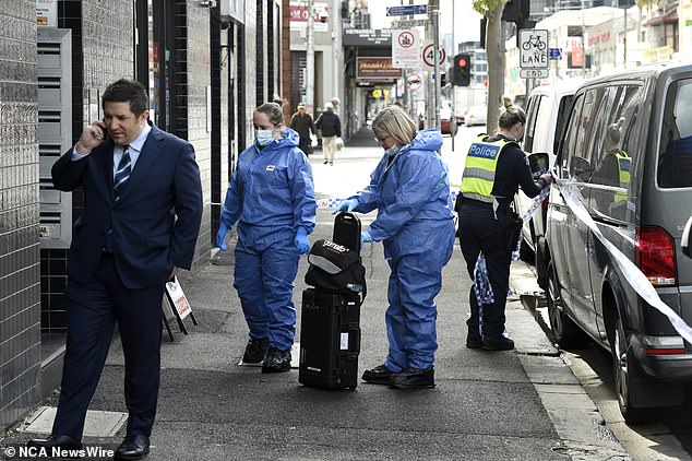 The girl is being held on bail in a secure care facility but has reportedly threatened staff several times (pictured, investigators on scene in Footscray)