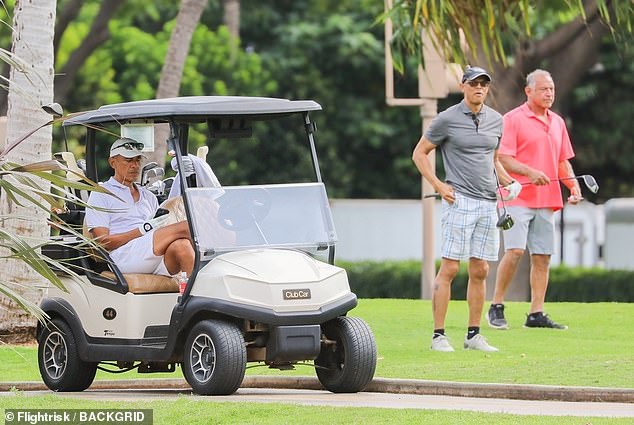 The 62-year-old appeared relaxed as he walked around the course with others