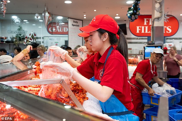 Thousands of Aussies will hit the fish markets this weekend in preparation for Christmas (pictured, Saturday's Sydney Fish Market)