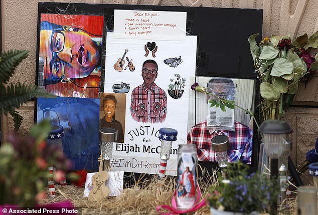 A makeshift memorial stands at a spot across the street from where Elijah McClain was stopped