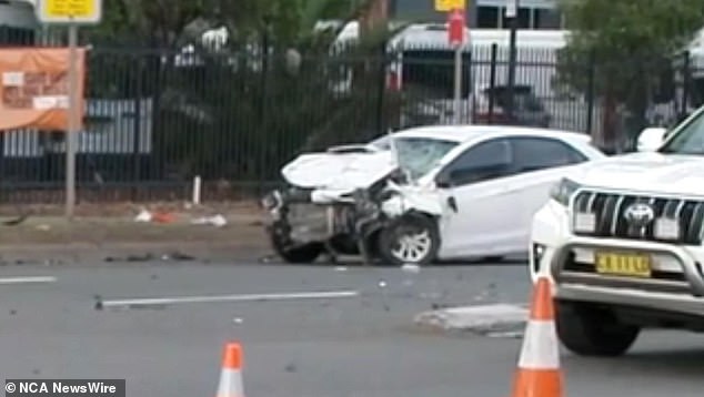 The three children, ages 10, 14 and 15, and a woman in her 40s were trapped in the SUV after the crash (above)