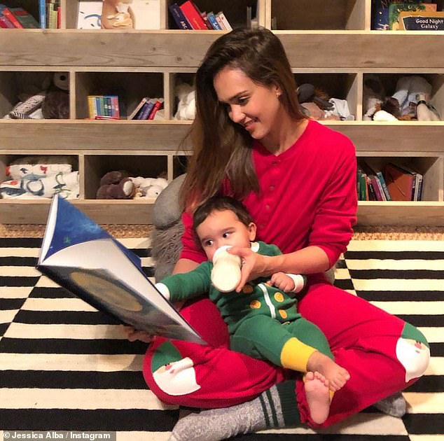 In one of her photos, the star read a book while feeding her youngest child during his early years