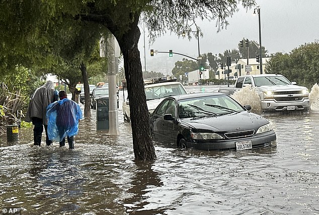 Neighborhoods in Southern California were inundated with several inches of rain and flash flooding Thursday, leaving vehicles stranded on flooded roads