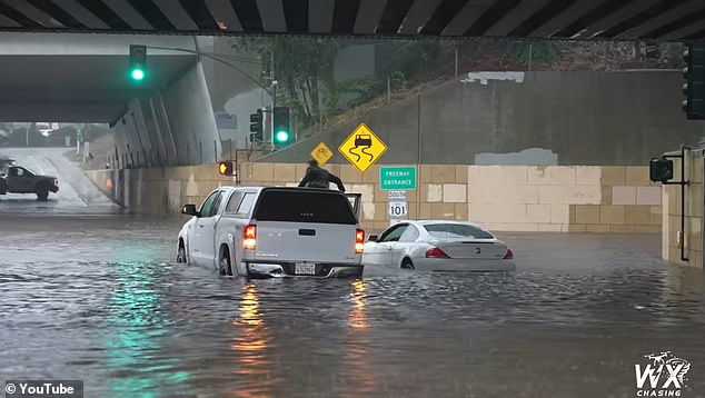 The truck eventually managed to wade through the deep water and escape the dramatic puddle