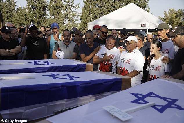 Mourners gather for the funerals of Lianne, Yahel, Noiya Sharabi - Eli's wife and daughters